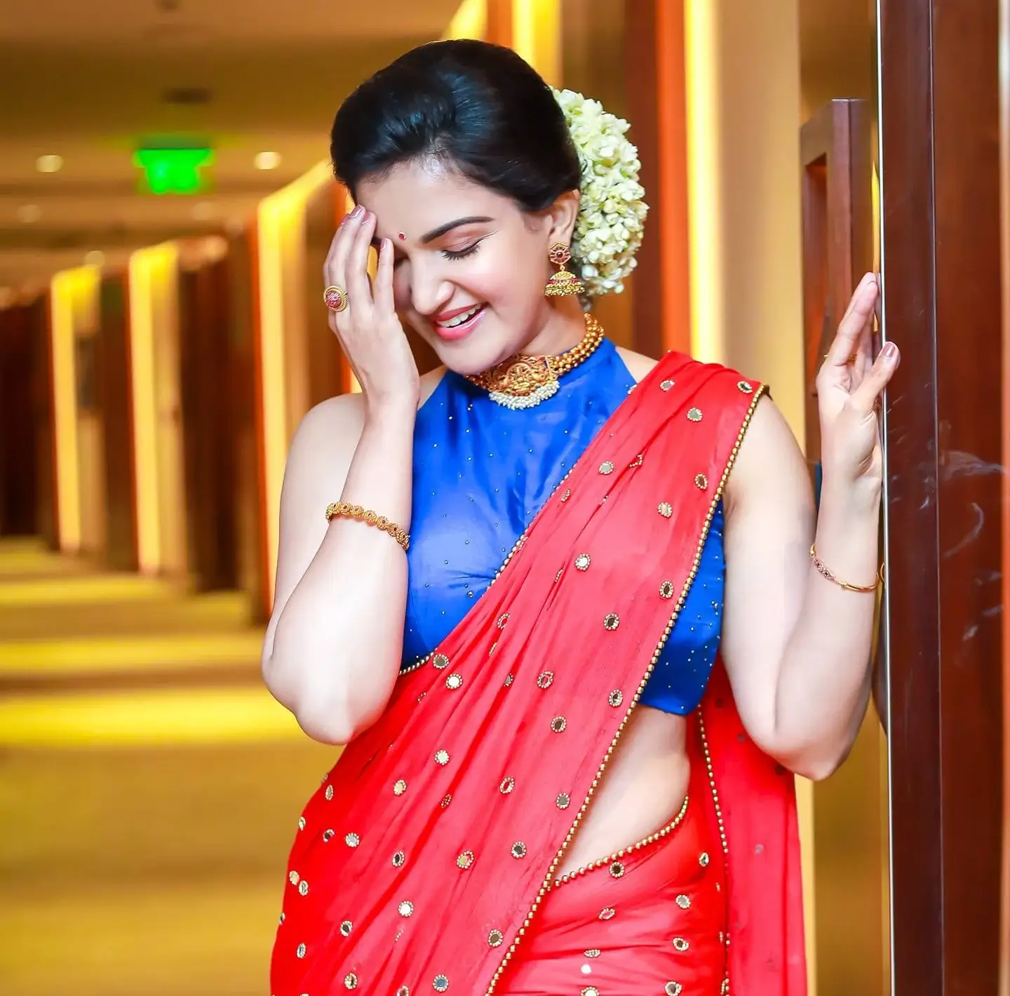 INDIAN ACTRESS HONEY ROSE IN SLEEVELESS RED SAREE 6